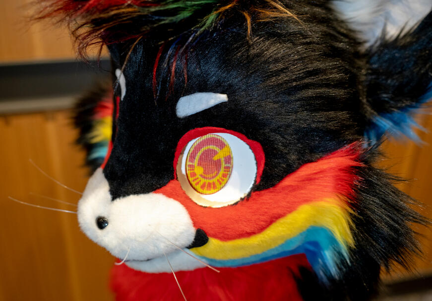 closeup of black and red cat fursuit